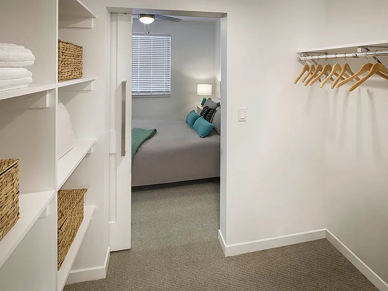 Large walk-in closets also feature built-in shelving