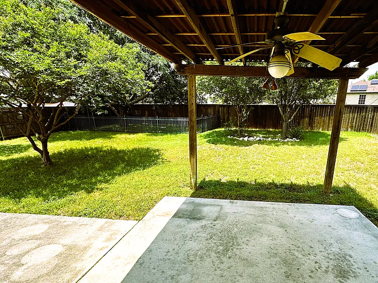 Large patio and mature trees