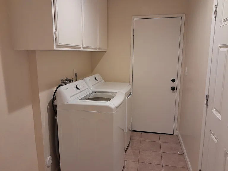 Laundry Room with washer, dryer and overhead cabinet