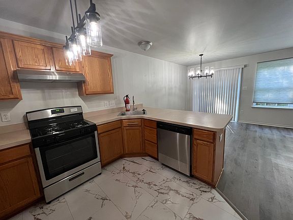 view to dining and living rooms from the kitchen