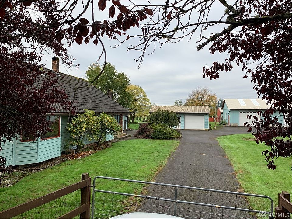 4.7 acre property.  Gated entry.  Wonderful location just a few minutes from hwy 12.  Circular drive with 2 gates.  Home, large garage, huge shop/garage and an additional barn in the back.  Mature landscaping.  Fenced garden space.  Truly a unique and special place to make memories!