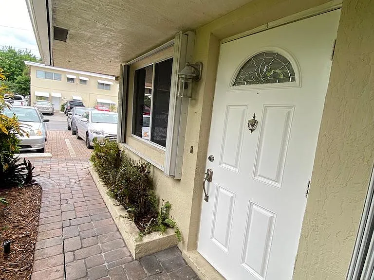 Front door view facing east. Literally about 12-15 steps from your designated/ reserved parking place able to hold 2 cars