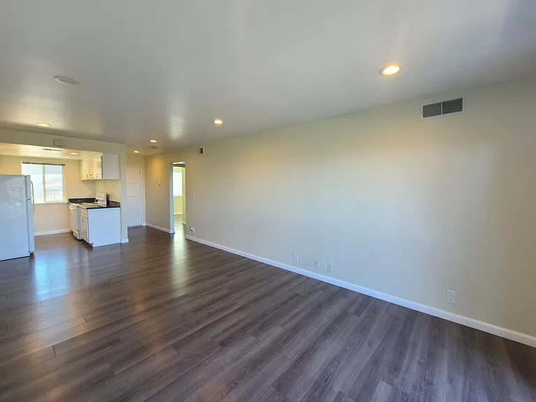 New Grey Oak Laminate Wood Flooring throughout Kitchen and Living Spaces