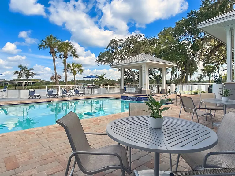 Bask in the open-air elegance and savor the panoramic river views from a variety of seating options around the sprawling pool deck.