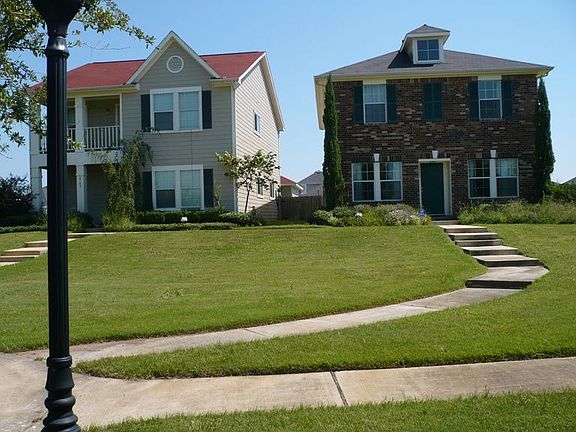 Front of house in relation to neighbor's house.