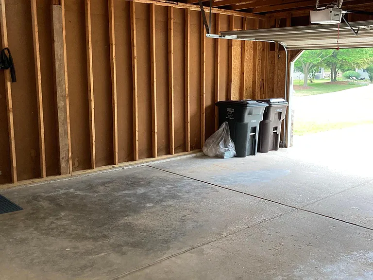 Spacious 2 car garage with extra storage area