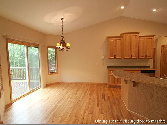 Dining area with hardwood floors.