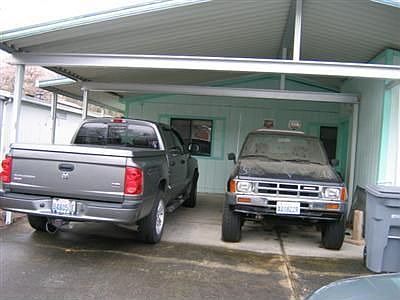 Double,side by Side Carport with Storage Shed.