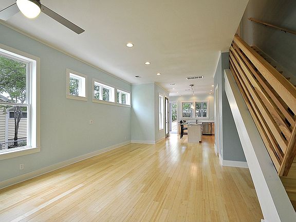 Bamboo floors, high ceilings, expansive space: one gorgeous living room!