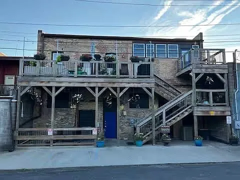 Rear of building. Entrance is on second story. Private patio to the right.