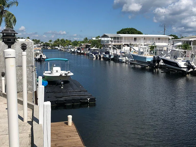 70' wide canal leading directly to bay.