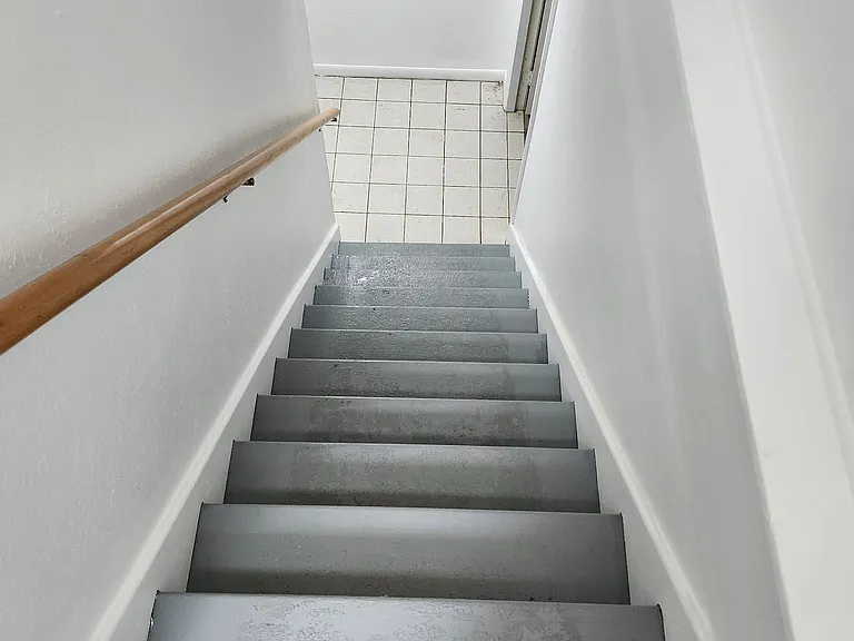 Stairway down into basement to access laundry