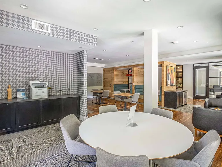 Create and collaborate in our community work studio, filled with natural light from floor-to-ceiling windows.