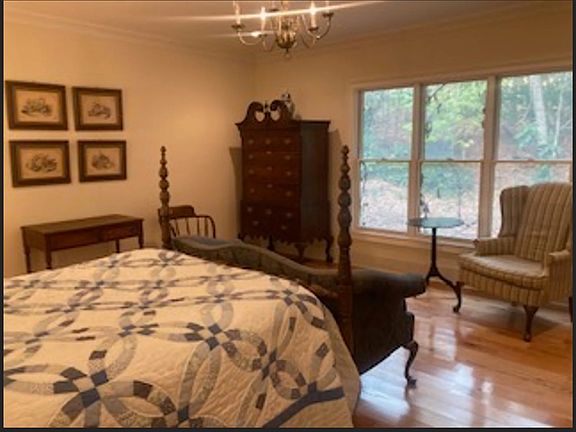 Spacious second BR with view of private woods, regular size bed, large closet.