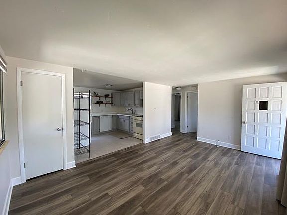 Main Level - living area (closet on left, front door open on right)