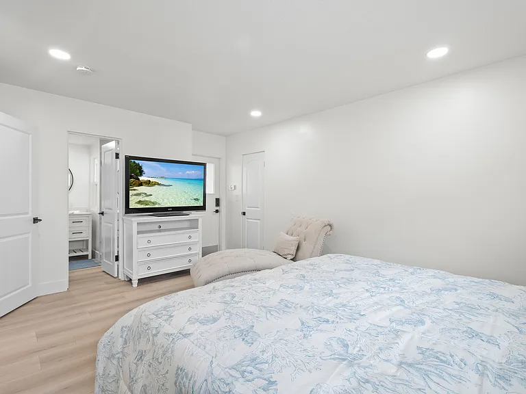 Master bedroom (to the right of the TV is a door that leads to the garage)