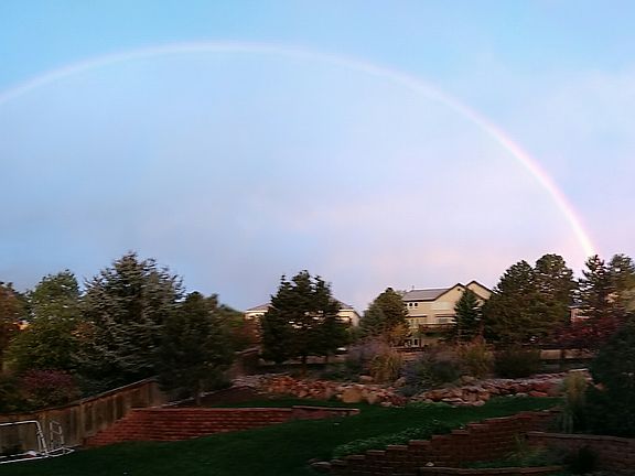 Full rainbow over mountains