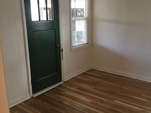 This is the living room entrance. There are two entry doors. One in the kitchen as well. New hardoowd floors -