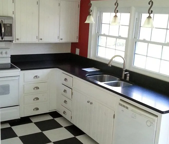 Kitchen - range, microwave, dishwasher, fridge. There is a closet that holds the washer and dryer.