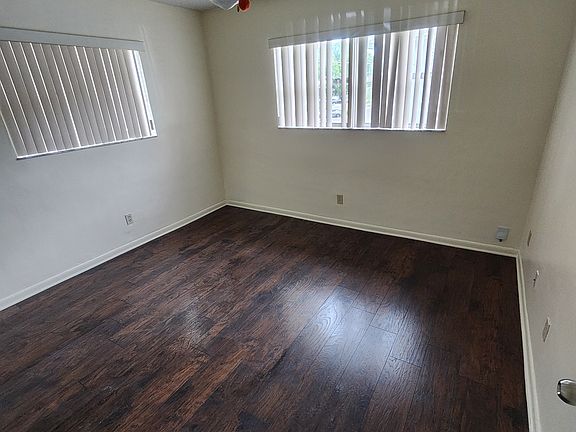 Spacious view of bedroom with brand new hard wood flooring.