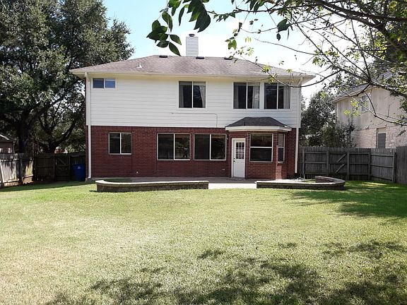 Large private backyard with paver patio