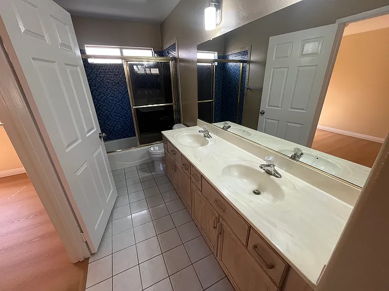 Full guest bathroom with double sinks