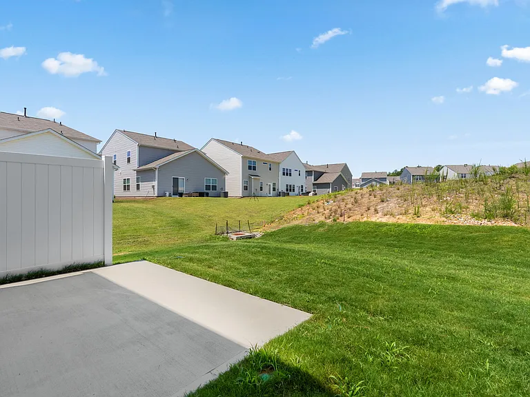 Backyard and Patio- End Unit Provides More Side Yard Space and Ample Room For Backyard Play