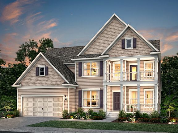 Vanderbilt New Home Exterior 54 with porches on the upper and lower levels with shake accents.