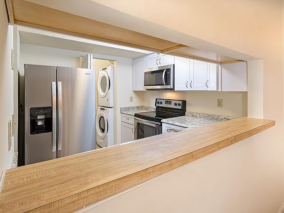 View of kitchen from dining room pass-thru
