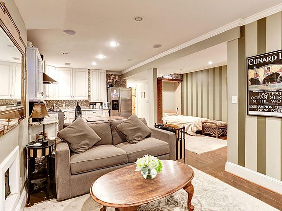 Living room opens to Kitchen
