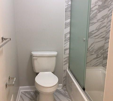 Beautiful 2nd bathroom with tub shower and glass door