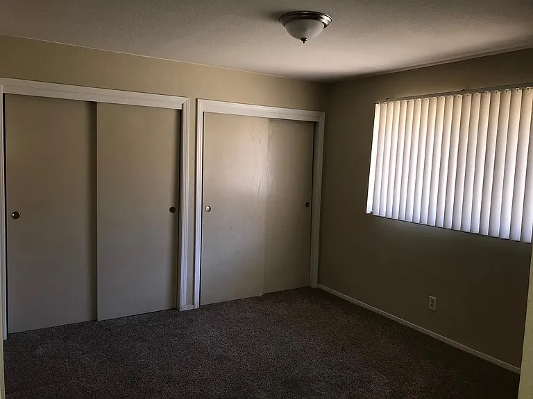 Large Master bedroom with lots of full wall of closet space. there is also storage space in the hallway closets.