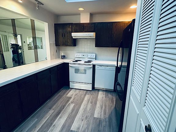Kitchen (Main View):
Light-filled kitchen featuring a skylight, ample cabinetry, and an efficient layout designed for comfort and accessibility.