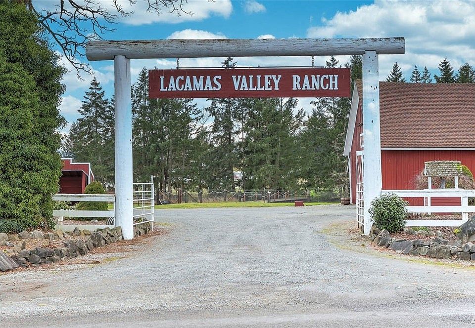 Welcome to the historic Lacamas Valley Ranch! This shy 25 acre property boasts a stunning Mt. Rainier view and equine amenities for the most avid horse person!  An approximate 7,200 square foot barn boasts an apartment with new separate septic system, an approximate 1800 square feet middle building that is drive through, a wood shed/fire pit area; two RV carports, an attached 3-car carport and is wired for a generator that stays.  The property is serviced by a community well located on the property that is owned and maintained by Washington Water Company and provides free water to the property. There are many different ways to earn extra income with this property by using it for hosting weddings and events, growing and selling hay or local grass, farming, horse boarding plus using the apartment for short term rental (AIR BNB or VRBO) or additional rental income.  All this plus the Lacamas Creek that runs adjacent to the property and provides that sense of nature we all crave!