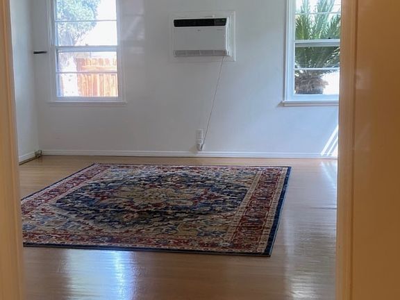 looking into empty living room from small dining room