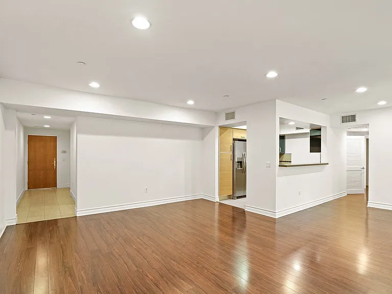 Spacious Living Room with Vinyl Flooring and Recess Lighting