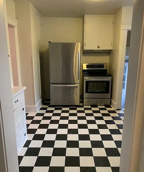 Refrigerator with bottom drawer freezer with ice maker. Smooth top cooking area with self cleaning oven.