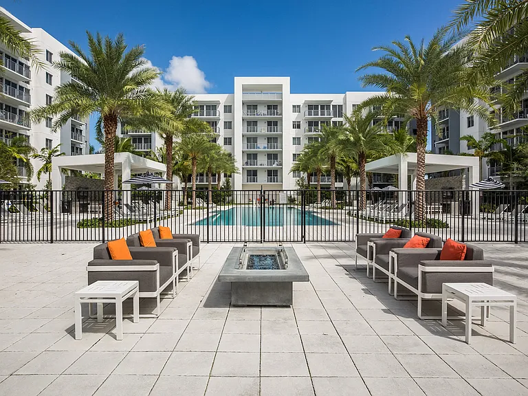 Outdoor lounge area featuring a firepit