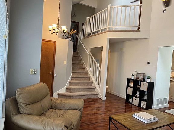 Stairs leading to 4 bedrooms including private master suite on additional level