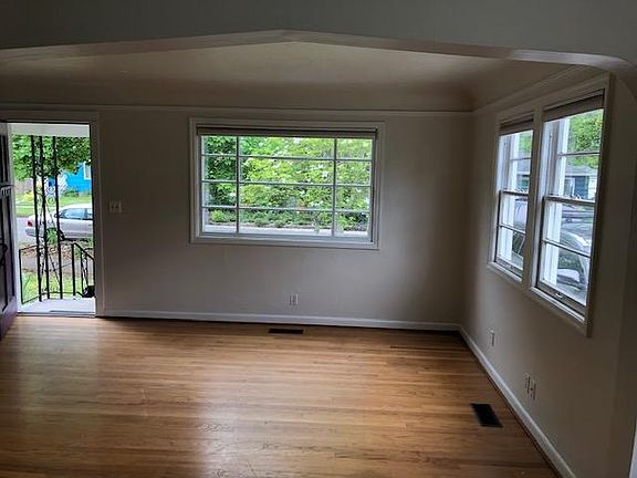 Living room view of street-this is before hardwoods were re-finished (done today, no pics available)...and also before new windows installed (coming this week)