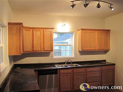 Modern kitchen with lots of surface, storage, and lighting