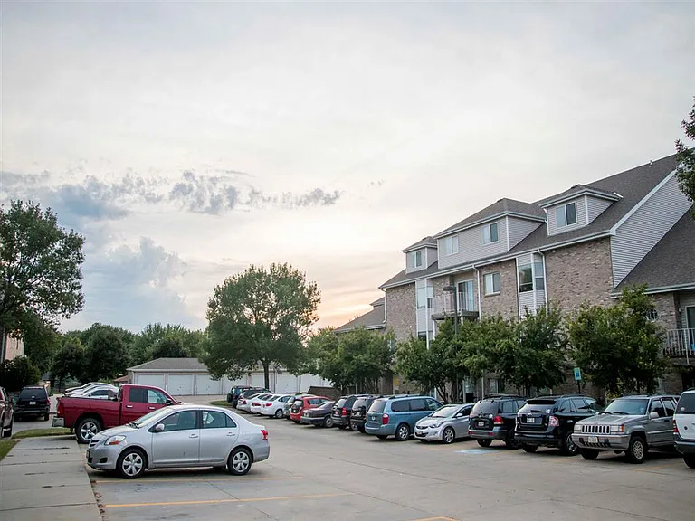 Our well-maintained community offers plenty of surface parking and garage options, surrounded by lush trees and thoughtful landscaping for a peaceful, welcoming atmosphere.
