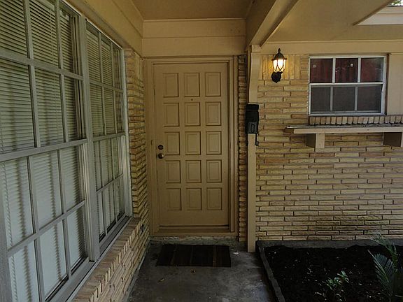 Recently repainted front door makes this is a very inviting entry way.
