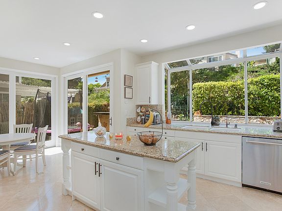 Bright kitchen with direct view to back yard.