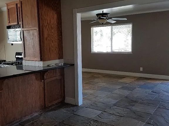Dinning room looking into living room and kitchen to the left