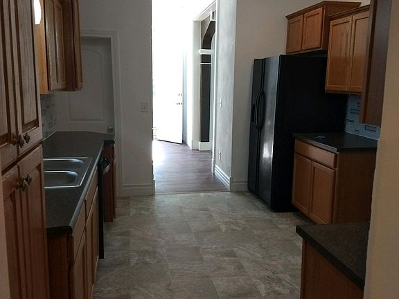 KITCHEN VIEW FROM LAUNDRY AREA