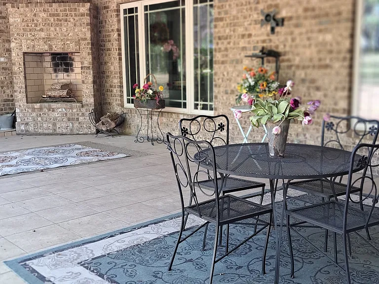 Back porch with table and four chairs