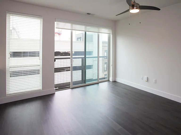 Living Room with Balcony and Hard Surface Flooring