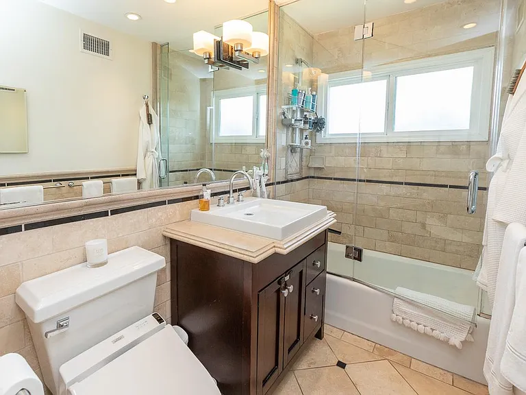 Bathroom with travertine tile throughout including walls and floors