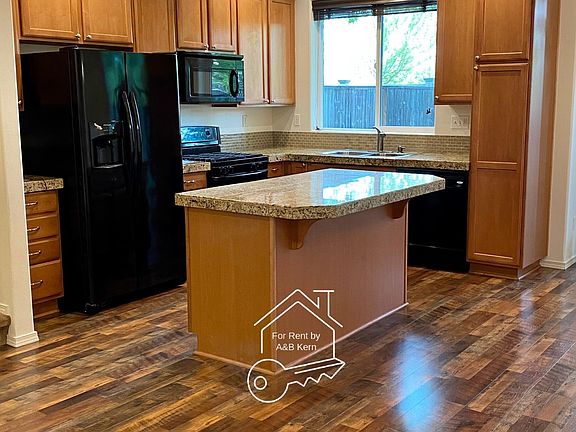 Kitchen with granite counters, pantry, breakfast bar, gas stove